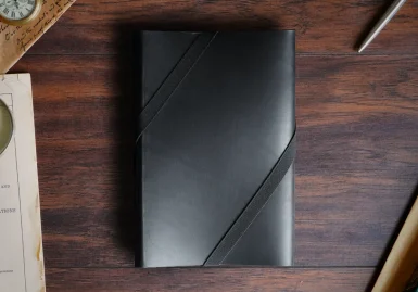 A leather everbook in midnight black leather with black elastic band