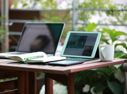 A desk with a notebook, an ipad, and an everbook for maximum remote-work productivity